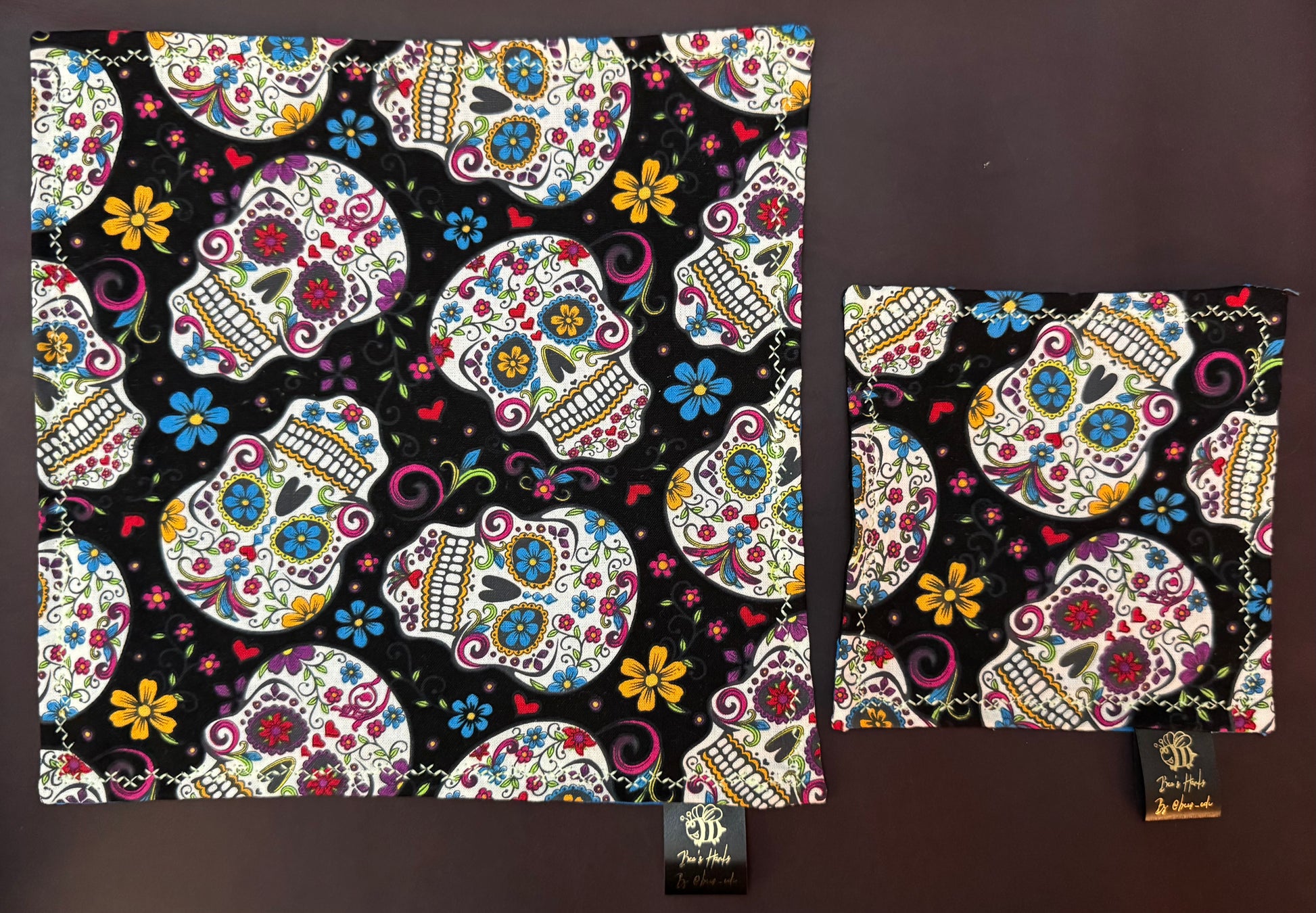 Sugar skulls with blue cotton / black microfiber backing edc hank with glow thread.