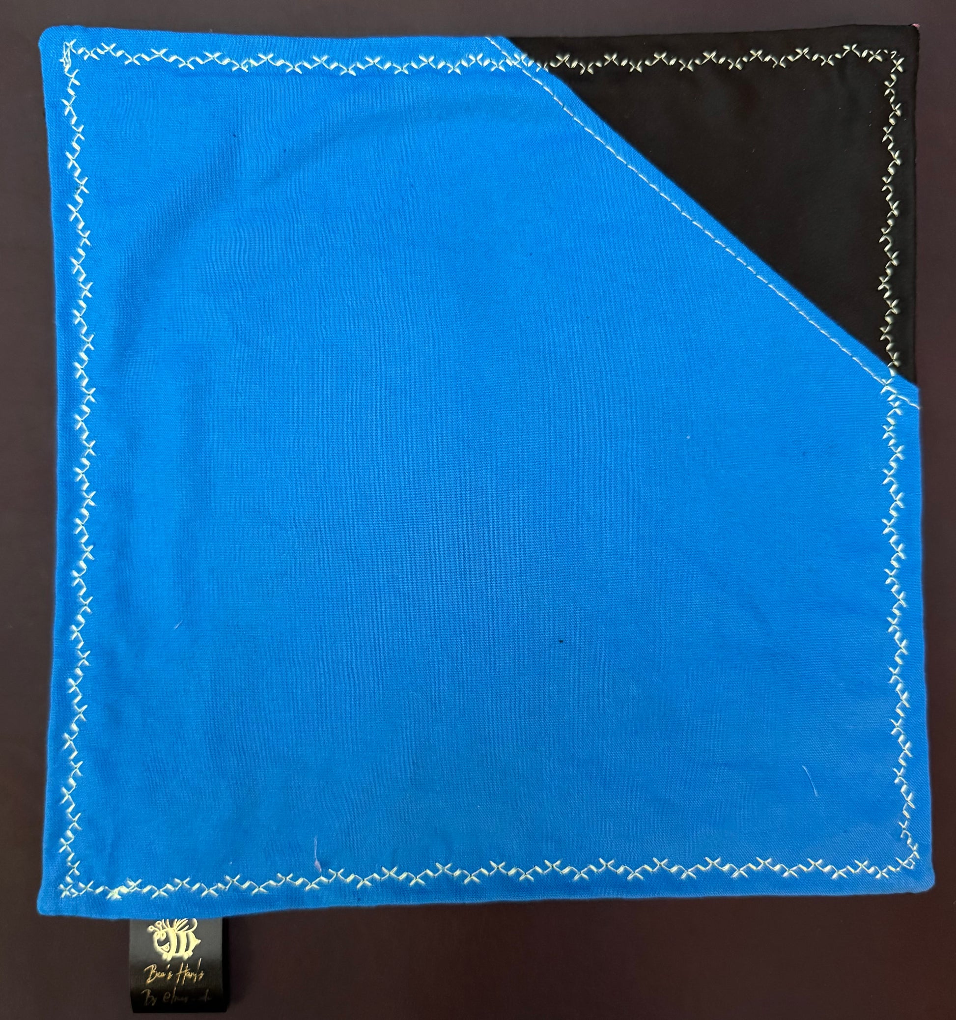 Sugar skulls with blue cotton / black microfiber backing edc hank with glow thread.