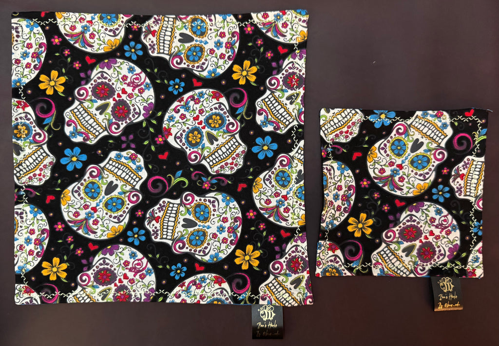 Sugar skulls with blue cotton / black microfiber backing edc hank with glow thread.