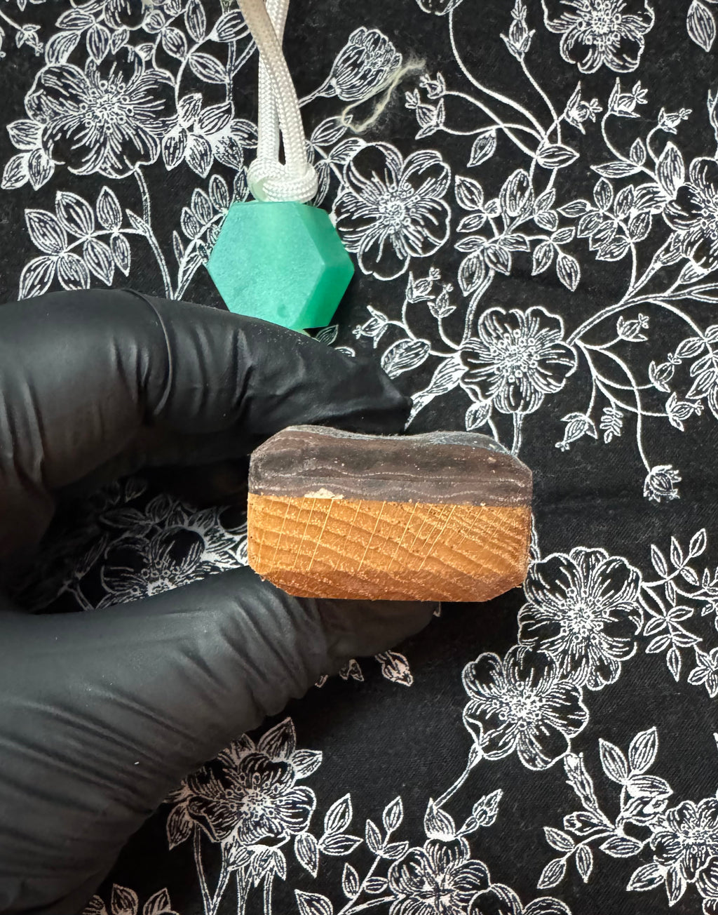 Red oak and fabric/resin composite worry stone with lanyard