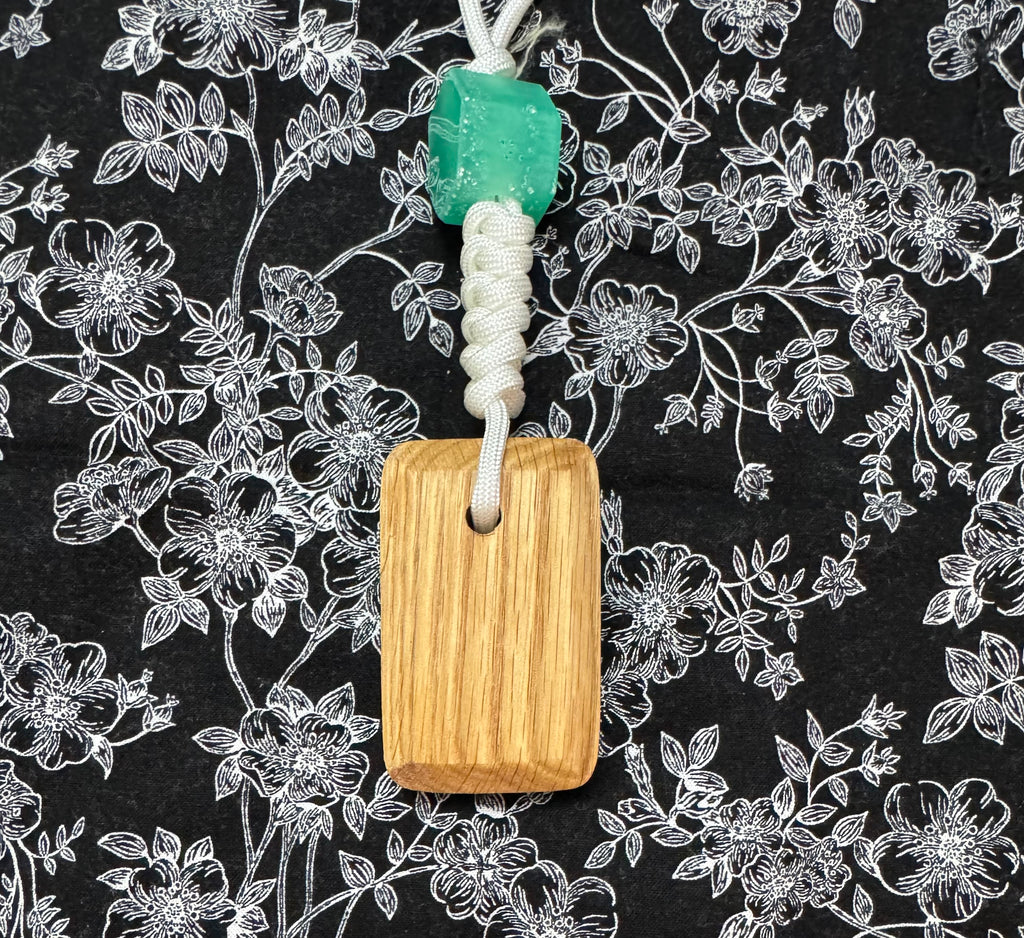 Red oak and fabric/resin composite worry stone with lanyard