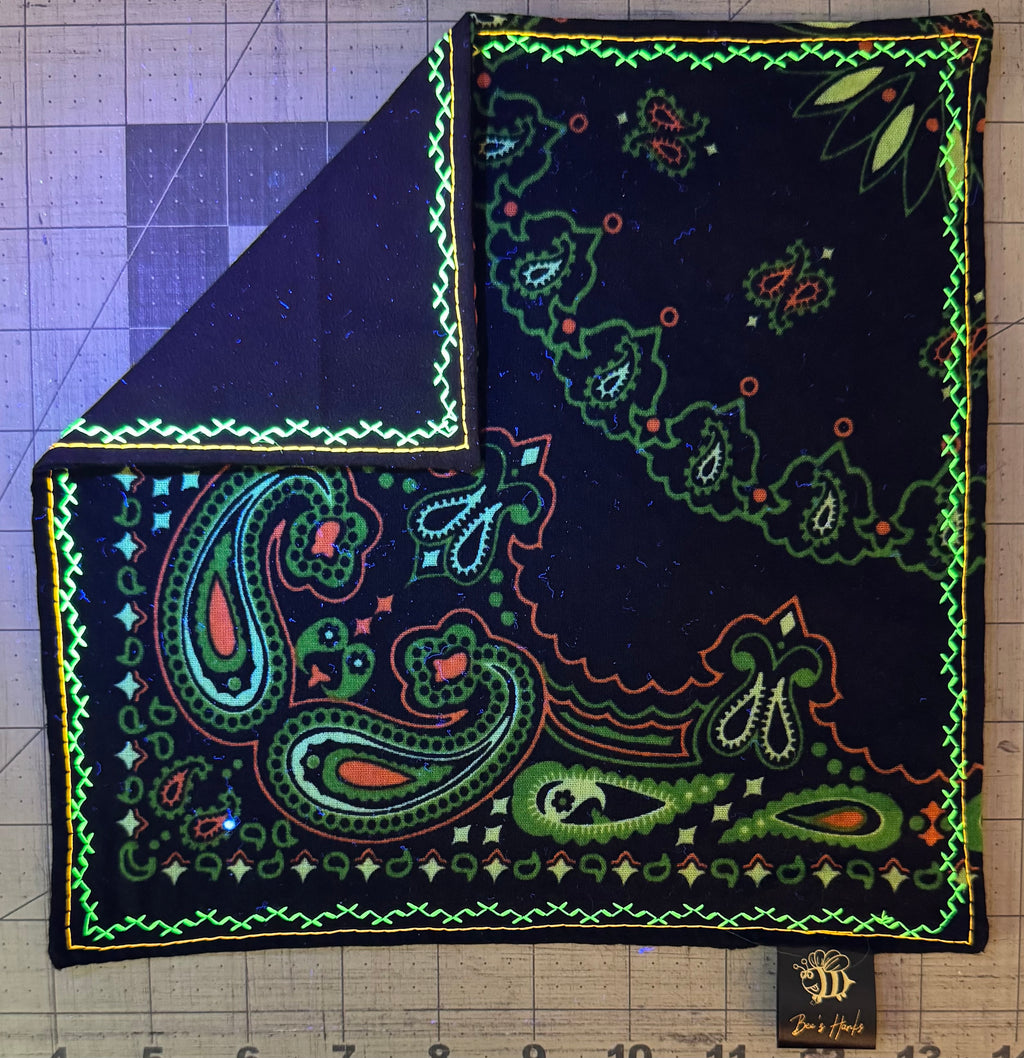 Neon green and orange paisley edc hank with glow thread.