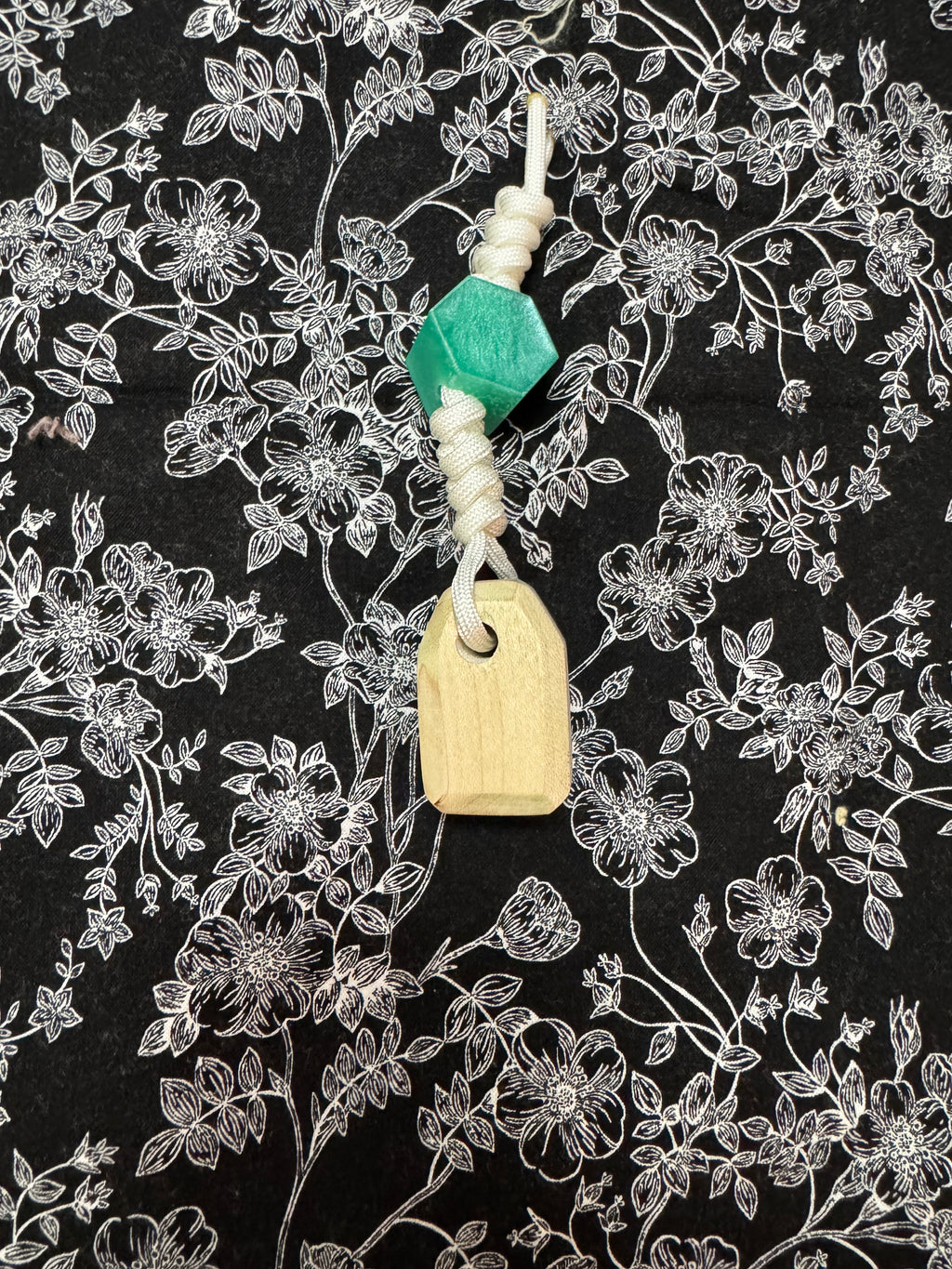 Light green stained Maple and fabric/resin composite worry stone with lanyard