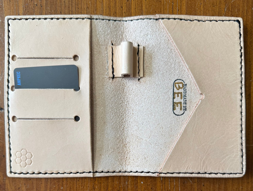 Leather pocket notebook cover/wallet with internal pen loop.