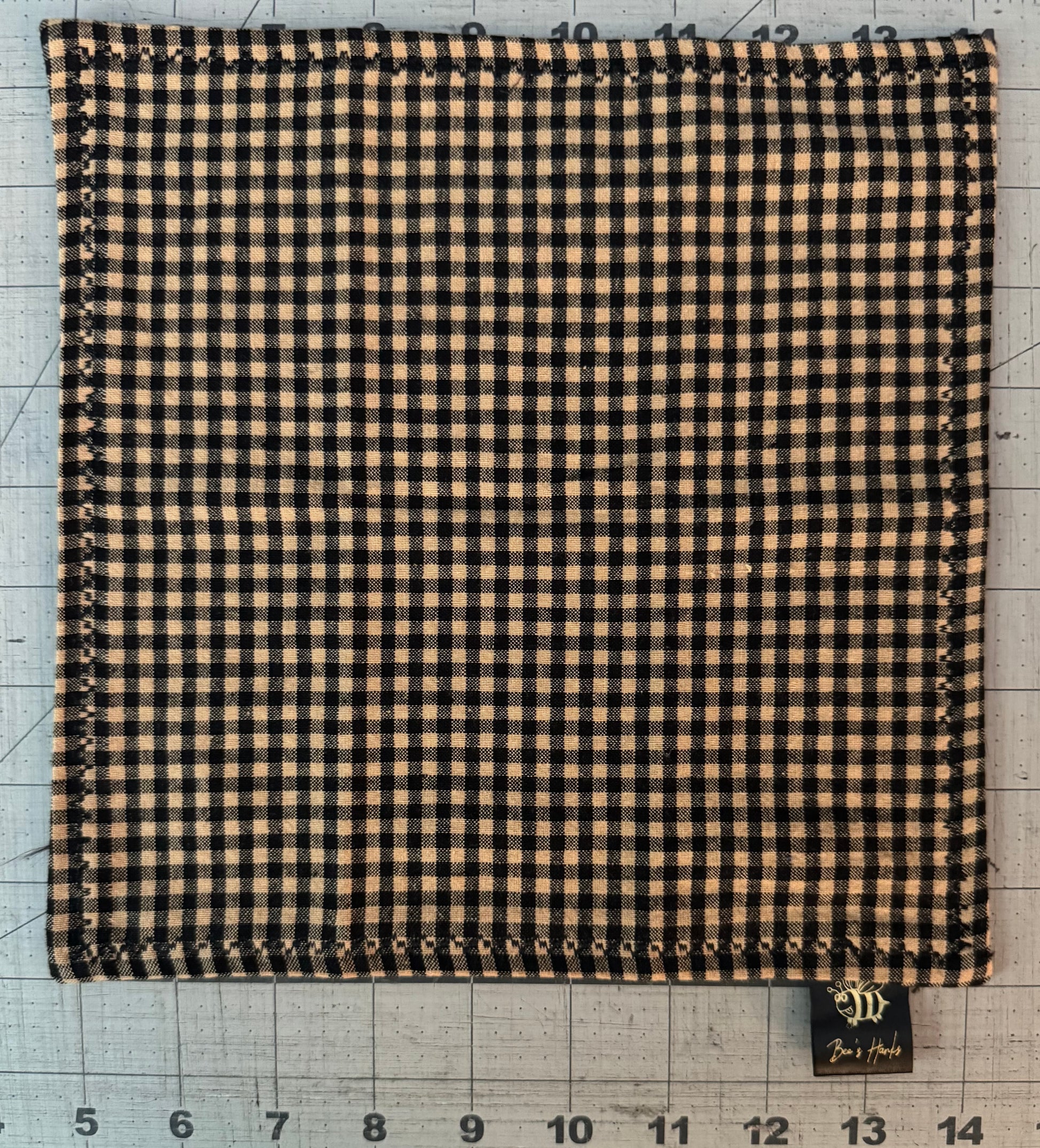 Black and tan checkered edc hank with black microsuede backing