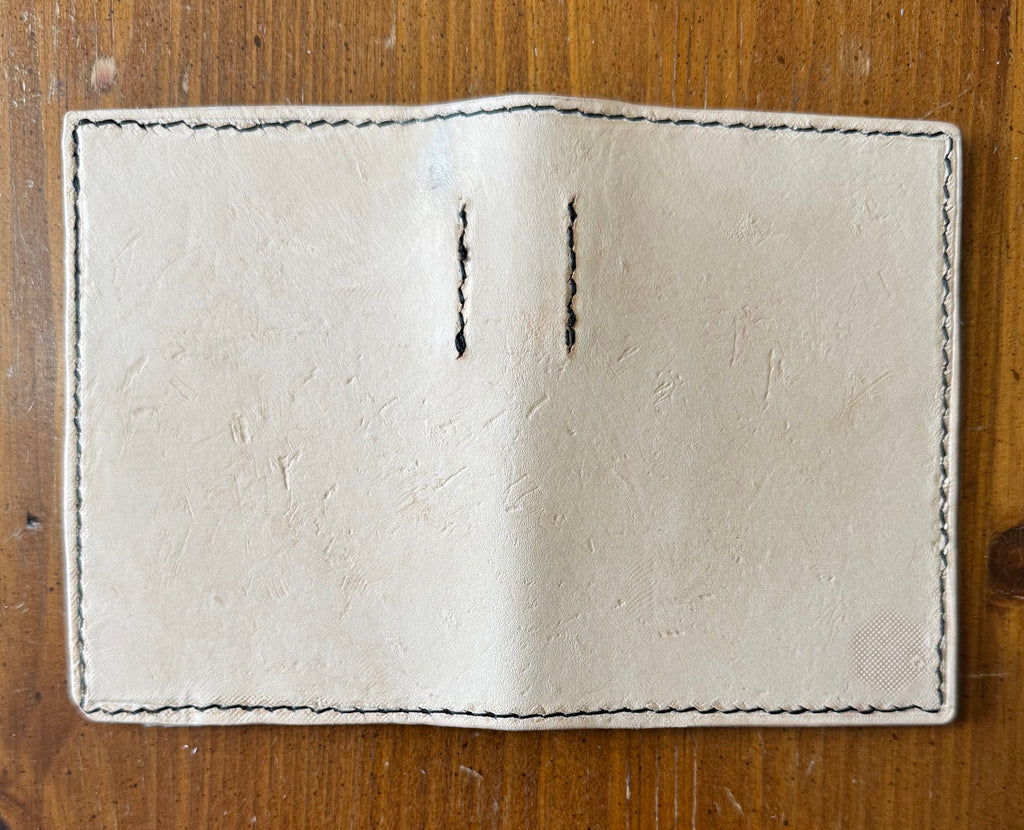 Leather pocket notebook cover/wallet with internal pen loop.