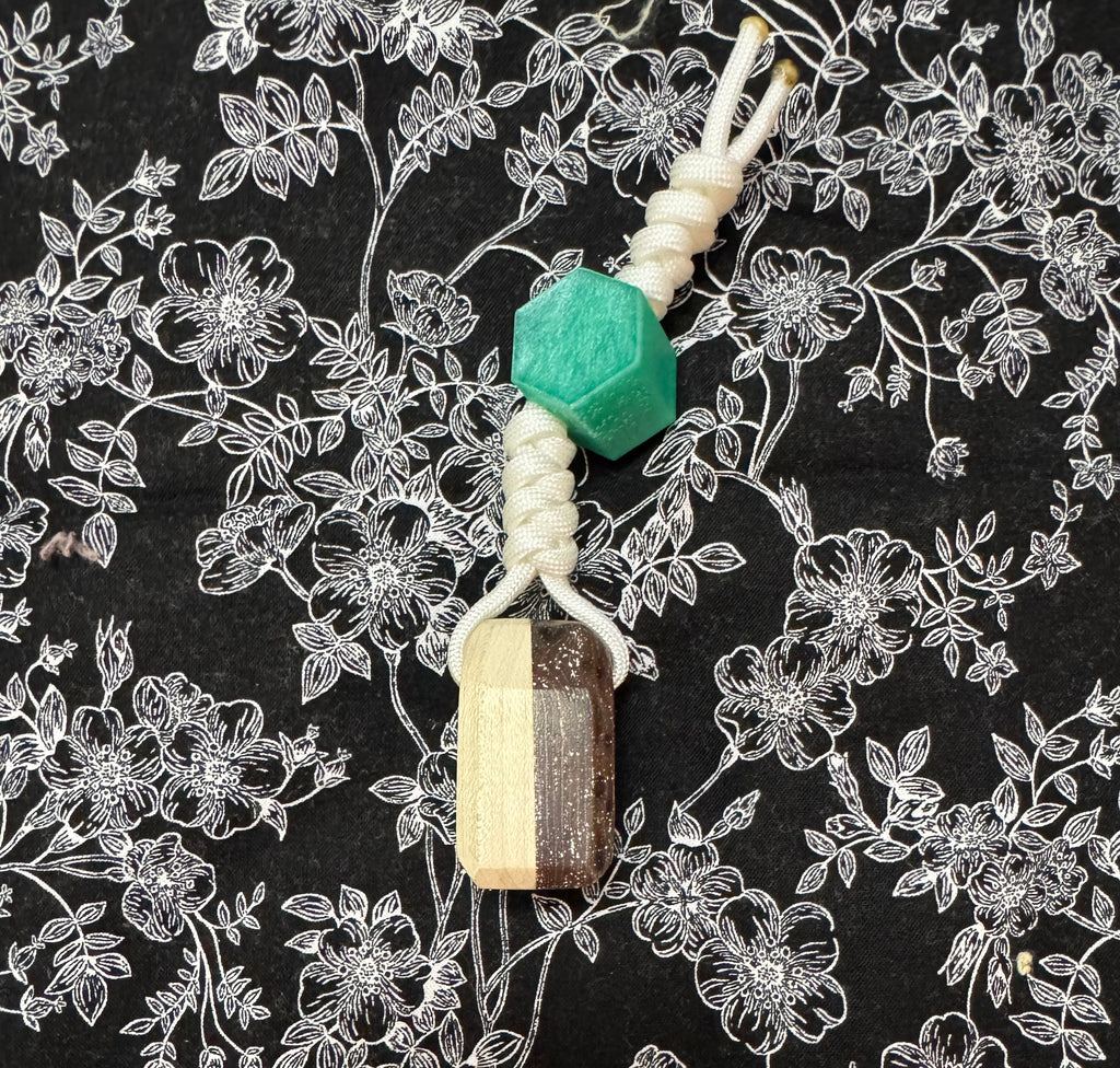 Light green stained Maple and fabric/resin composite worry stone with lanyard