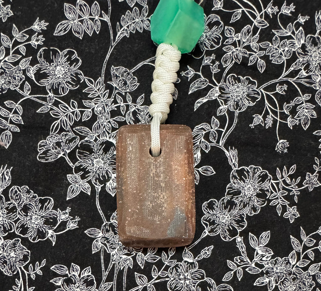 Red oak and fabric/resin composite worry stone with lanyard