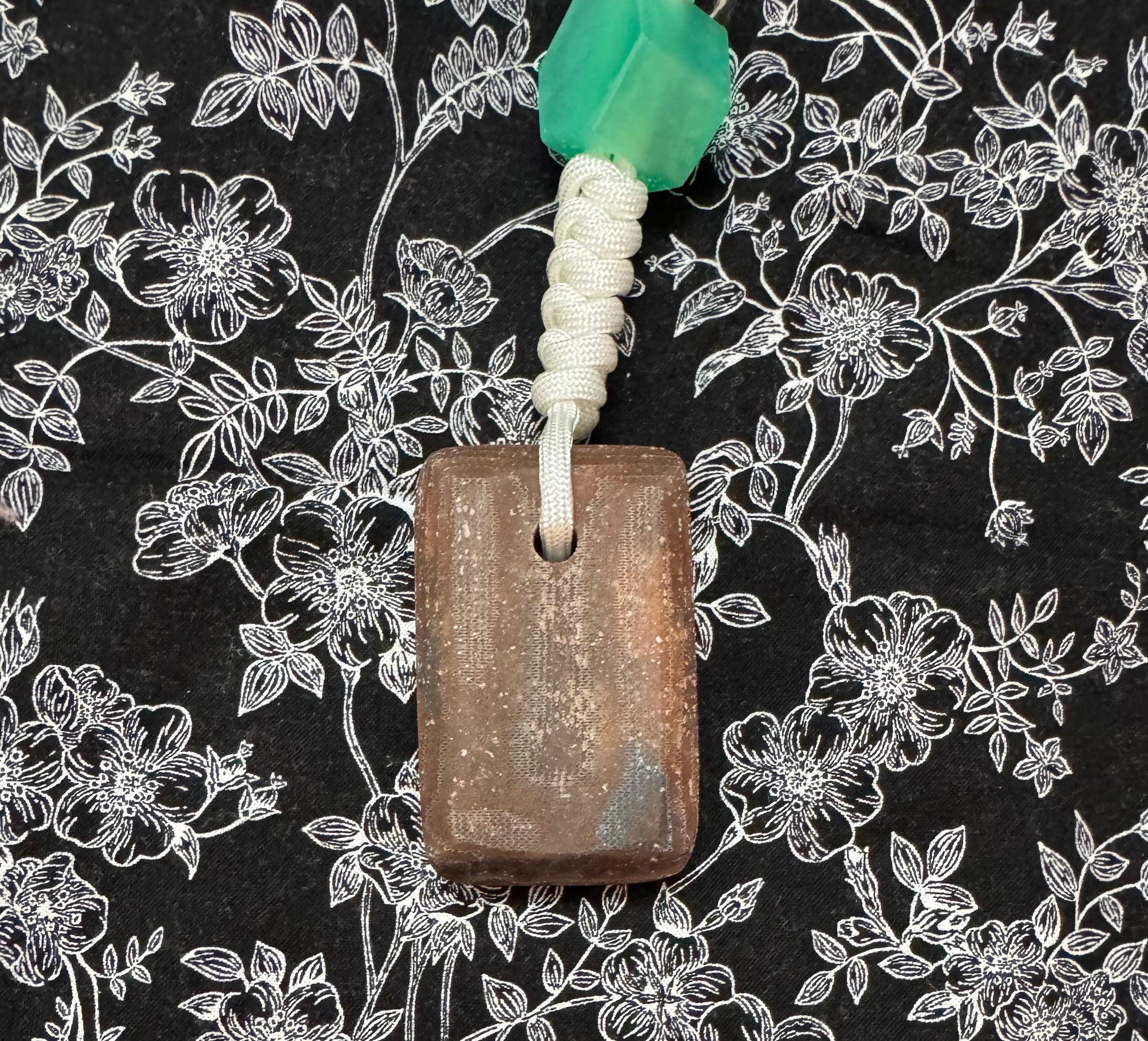 Red oak and fabric/resin composite worry stone with lanyard