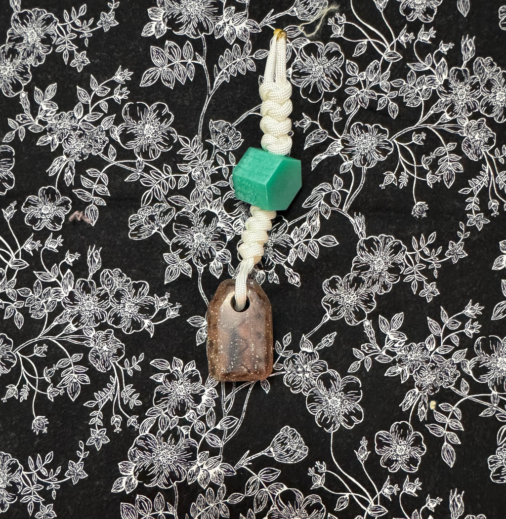 Light green stained Maple and fabric/resin composite worry stone with lanyard