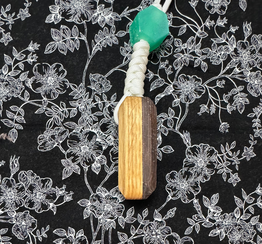 Red oak and fabric/resin composite worry stone with lanyard